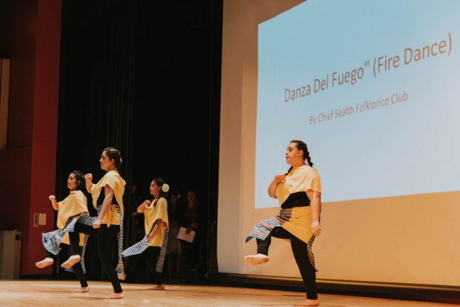 Four members of the Chief Sealth Folklorico Club performing the Dancza Del Fuego (Fire Dance).
